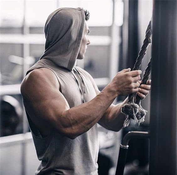 in a gym a person pulling the rope